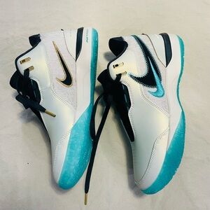 White and Teal Athletic Shoes with Black Accents
